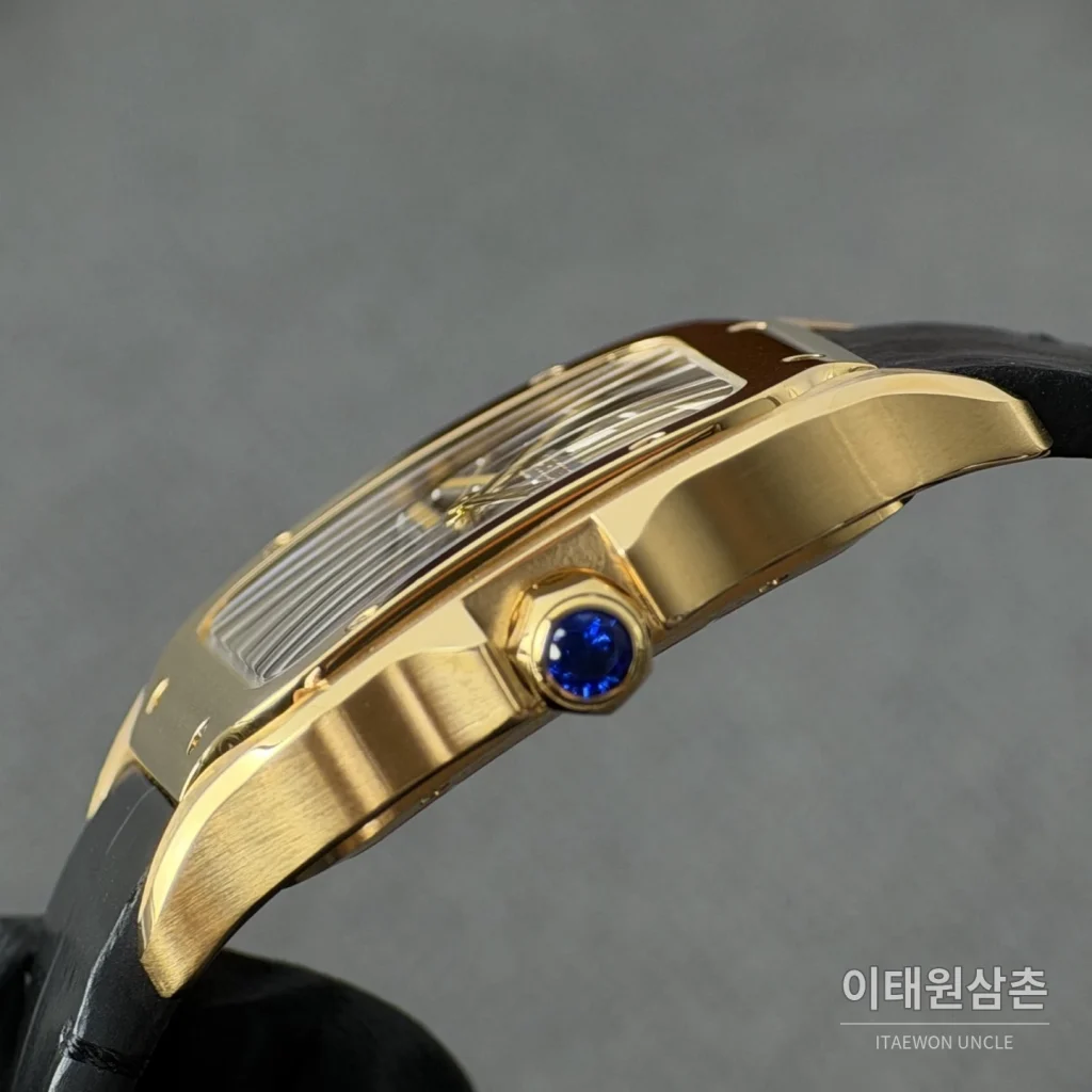 까르띠에 산토스 오토매틱 스켈레톤 다이얼 블랙 러버 스트랩 골드 베젤