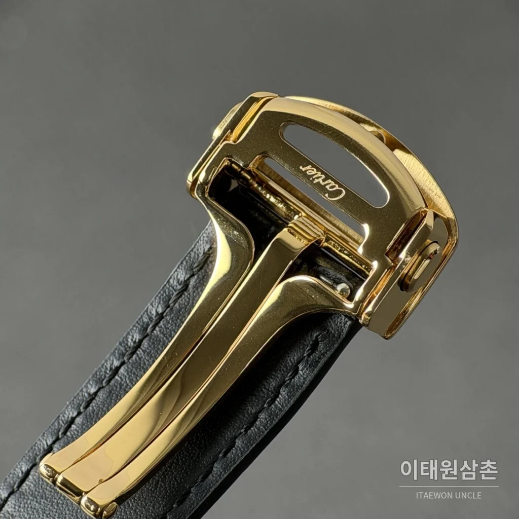 까르띠에 산토스 오토매틱 스켈레톤 다이얼 블랙 러버 스트랩 골드 베젤