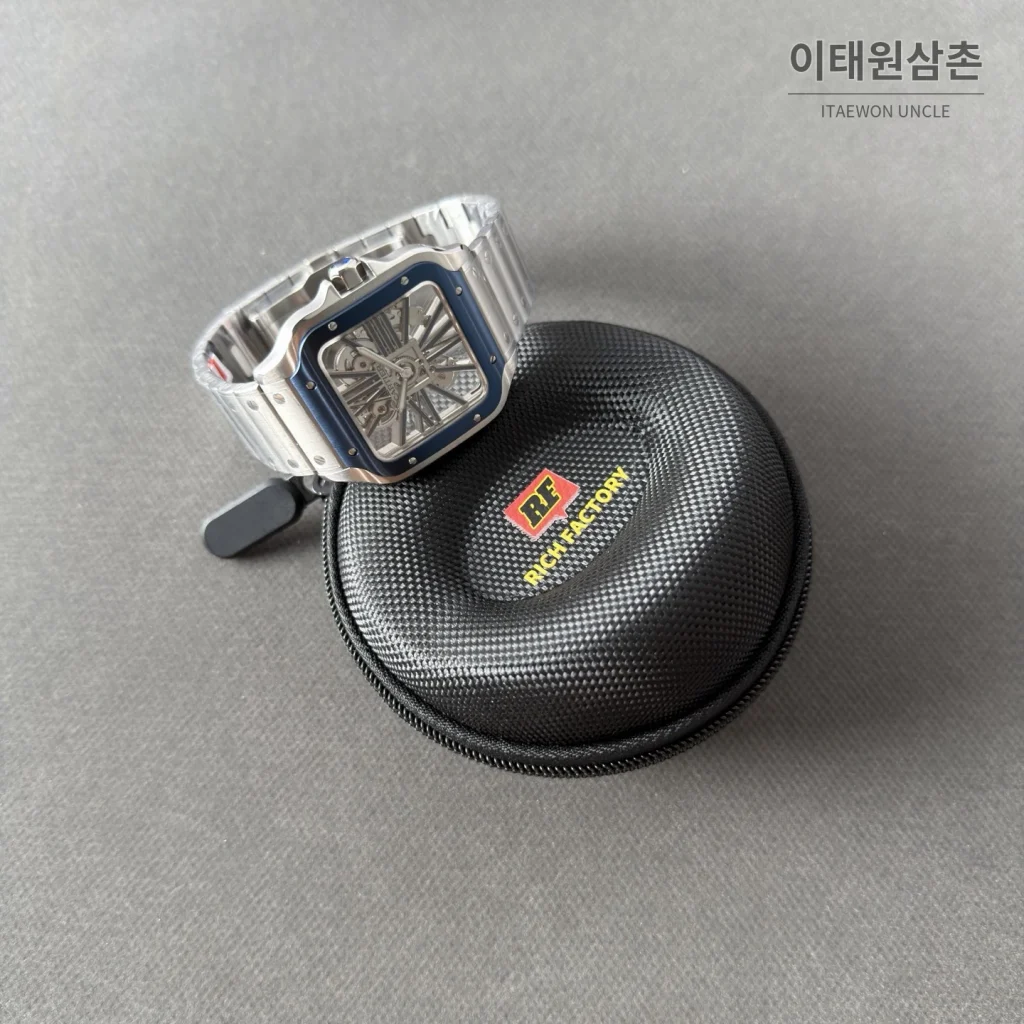 까르띠에 산토스 오토매틱 스켈레톤 다이얼 스틸 브레이슬릿 블루 베젤