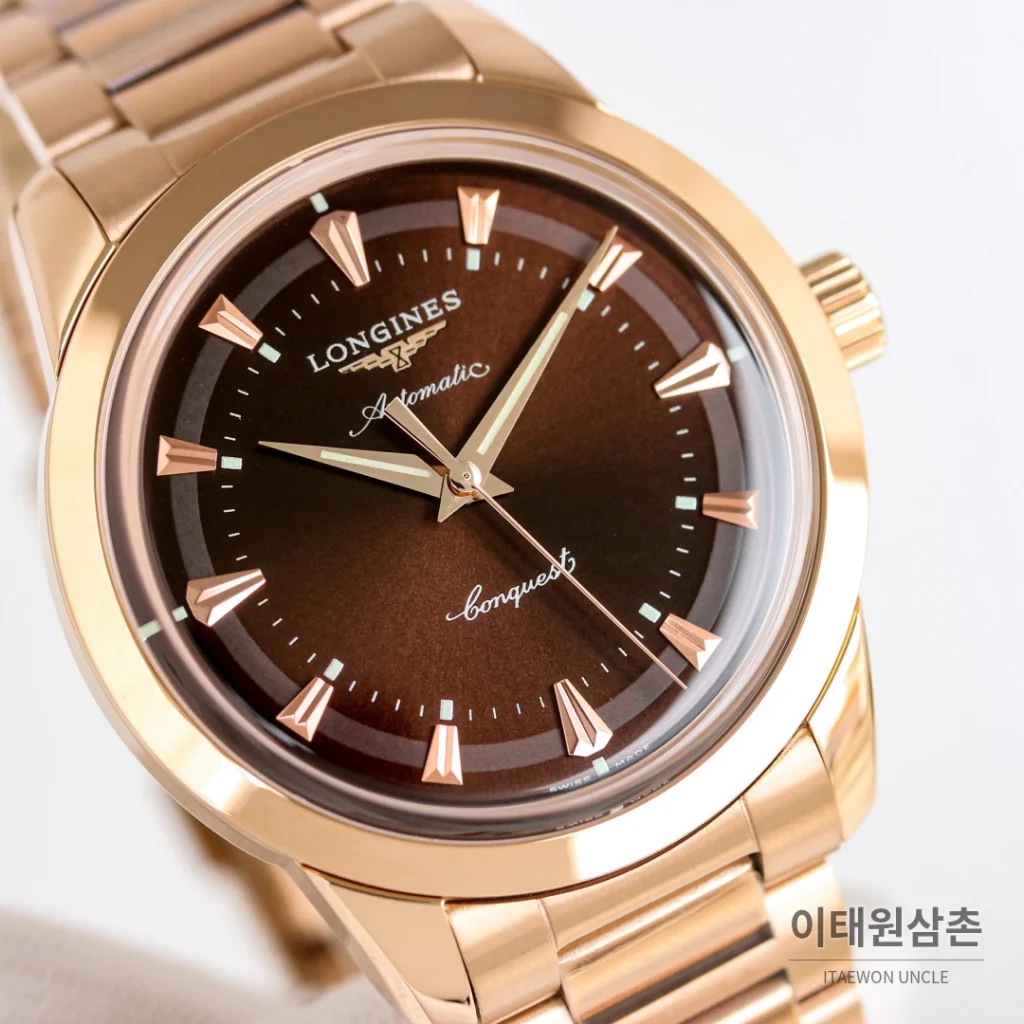 론진 콘퀘스트 헤리티지 스틸 쓰리핸즈 오토매틱 40mm 브라운 다이얼 로즈골드 브레이슬릿