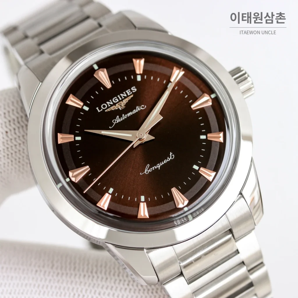 론진 콘퀘스트 헤리티지 스틸 쓰리핸즈 오토매틱 40mm 브라운 다이얼 스틸 브레이슬릿