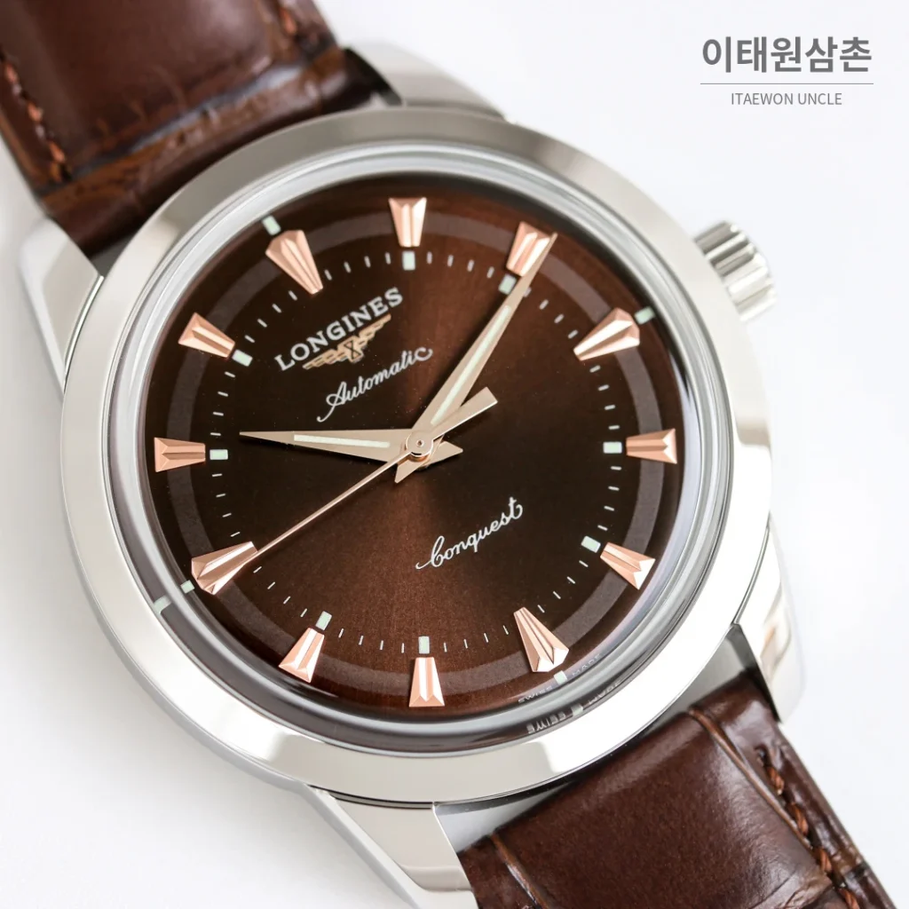 론진 콘퀘스트 헤리티지 스틸 쓰리핸즈 오토매틱 40mm 브라운 다이얼 스틸 브레이슬릿