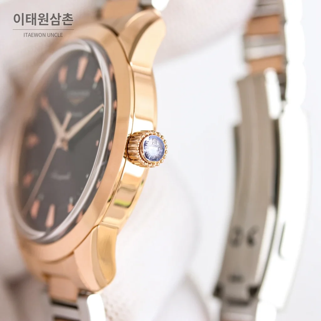 론진 콘퀘스트 헤리티지 스틸 쓰리핸즈 오토매틱 40mm 브라운 다이얼 로즈골드 브레이슬릿