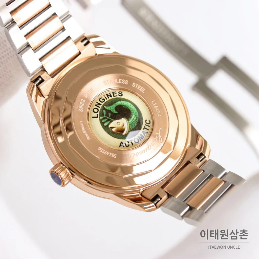 론진 콘퀘스트 헤리티지 스틸 쓰리핸즈 오토매틱 40mm 브라운 다이얼 로즈골드 브레이슬릿