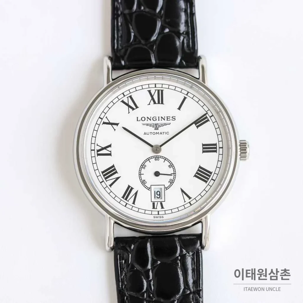 론진 엘레강스 스틸 화이트다이얼 로만인덱스 스몰세컨즈 오토매틱 38.5mm 블랙 가죽 스트랩