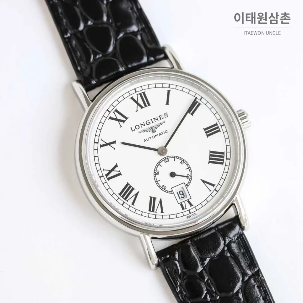 론진 엘레강스 스틸 화이트다이얼 로만인덱스 스몰세컨즈 오토매틱 38.5mm 블랙 가죽 스트랩