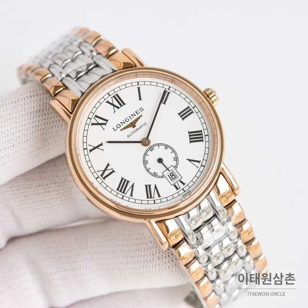 론진 엘레강스 스틸 화이트다이얼 로만인덱스 스몰세컨즈 오토매틱 38.5mm 투톤 브레이슬릿 로즈골드 베젤