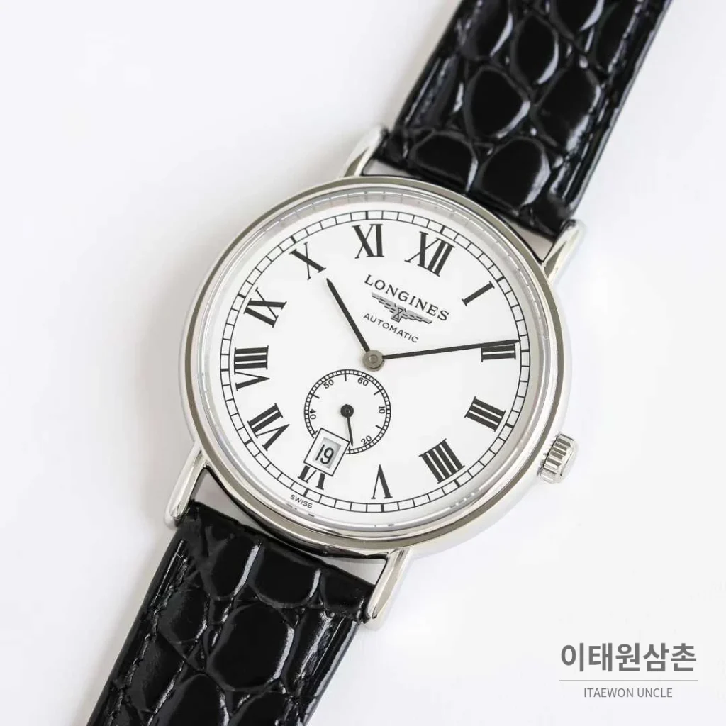 론진 엘레강스 스틸 화이트다이얼 로만인덱스 스몰세컨즈 오토매틱 38.5mm 블랙 가죽 스트랩
