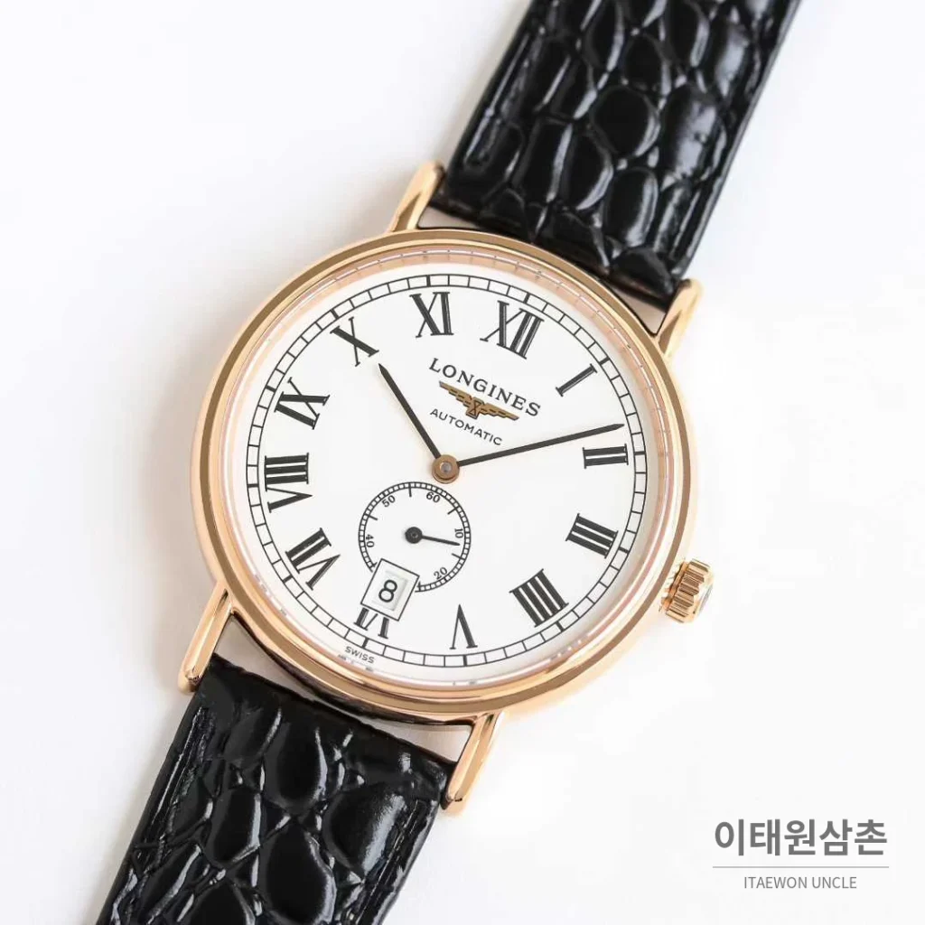 론진 엘레강스 스틸 화이트다이얼 로만인덱스 스몰세컨즈 오토매틱 38.5mm 블랙 가죽 스트랩 로즈골드 베젤