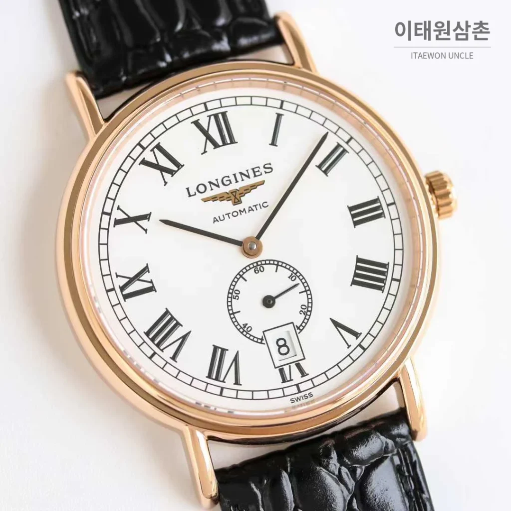론진 엘레강스 스틸 화이트다이얼 로만인덱스 스몰세컨즈 오토매틱 38.5mm 블랙 가죽 스트랩 로즈골드 베젤