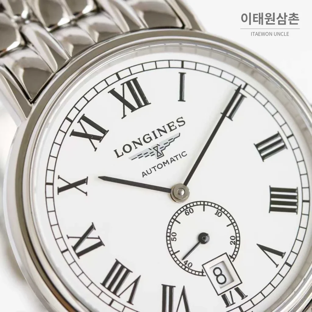 론진 엘레강스 스틸 화이트다이얼 로만인덱스 스몰세컨즈 오토매틱 38.5mm 스틸 브레이슬릿