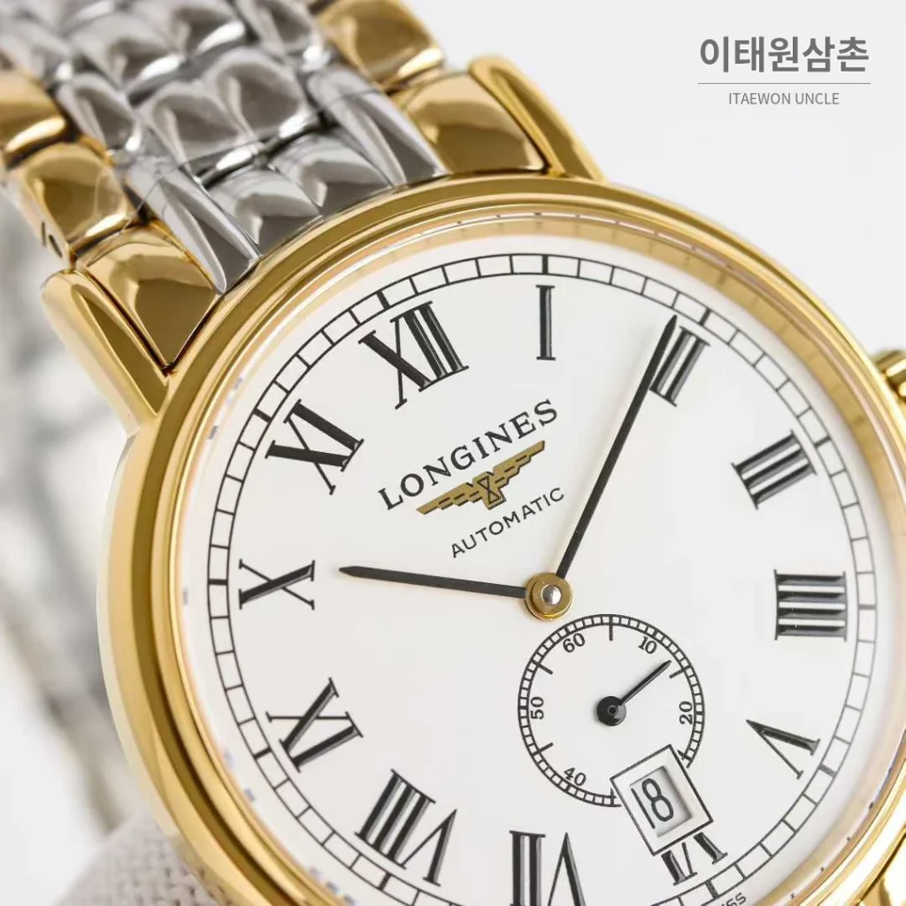 론진 엘레강스 스틸 화이트다이얼 로만인덱스 스몰세컨즈 오토매틱 38.5mm 투톤 브레이슬릿 골드 베젤