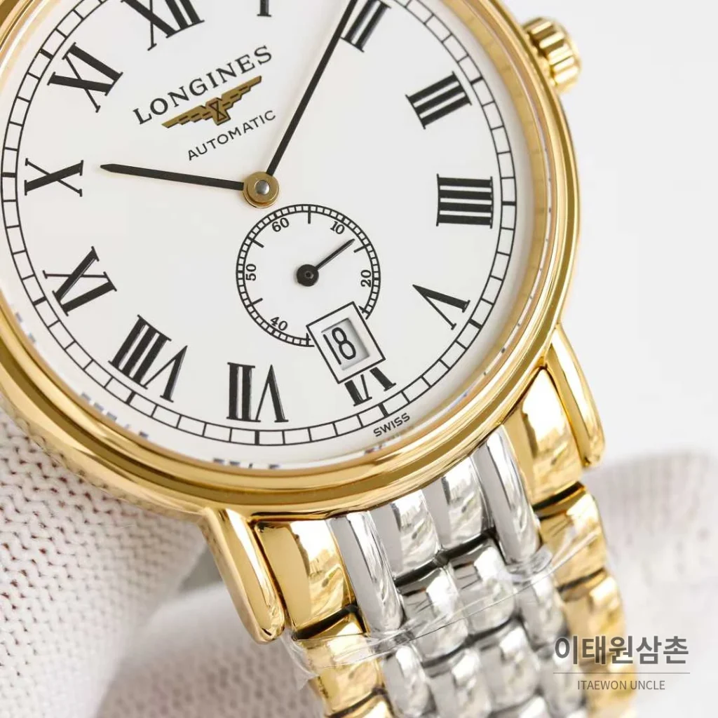 론진 엘레강스 스틸 화이트다이얼 로만인덱스 스몰세컨즈 오토매틱 38.5mm 투톤 브레이슬릿 골드 베젤