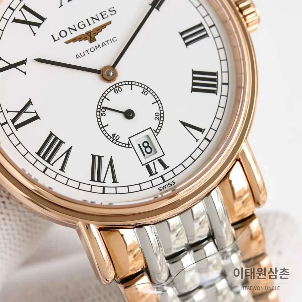 론진 엘레강스 스틸 화이트다이얼 로만인덱스 스몰세컨즈 오토매틱 38.5mm 투톤 브레이슬릿 로즈골드 베젤