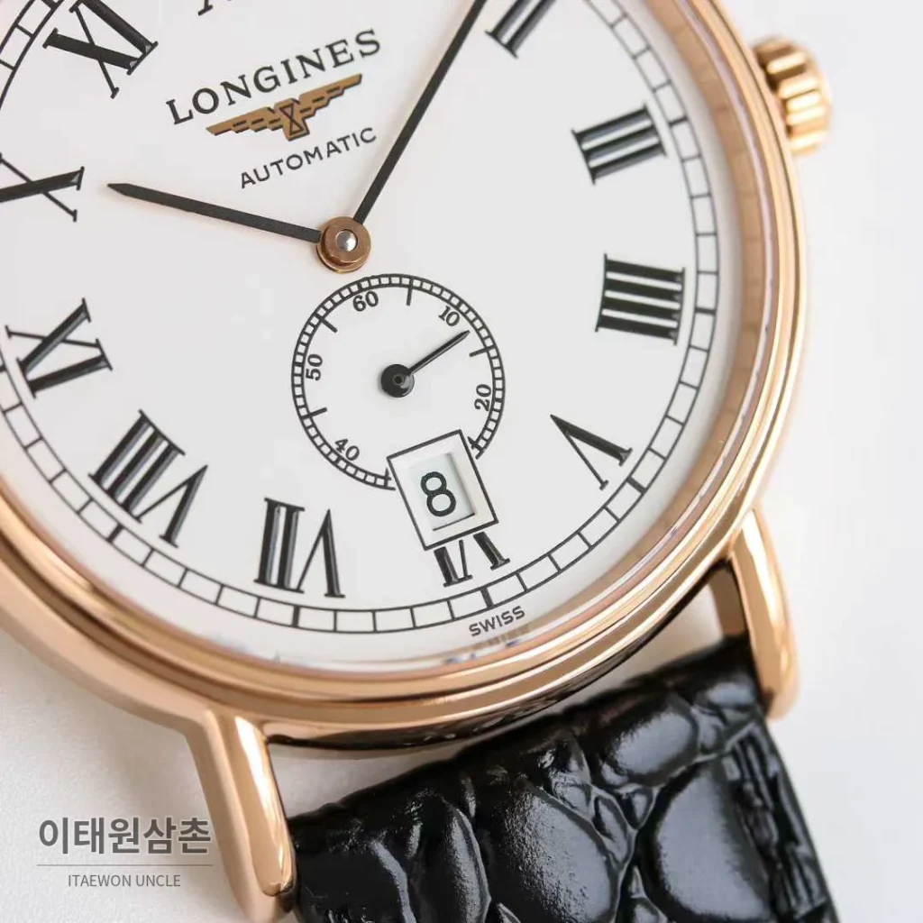론진 엘레강스 스틸 화이트다이얼 로만인덱스 스몰세컨즈 오토매틱 38.5mm 블랙 가죽 스트랩 로즈골드 베젤