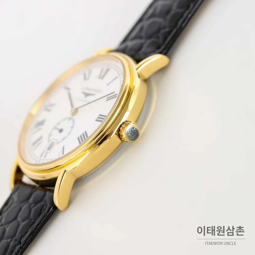 론진 엘레강스 스틸 화이트다이얼 로만인덱스 스몰세컨즈 오토매틱 38.5mm 블랙 가죽 스트랩 골드 베젤