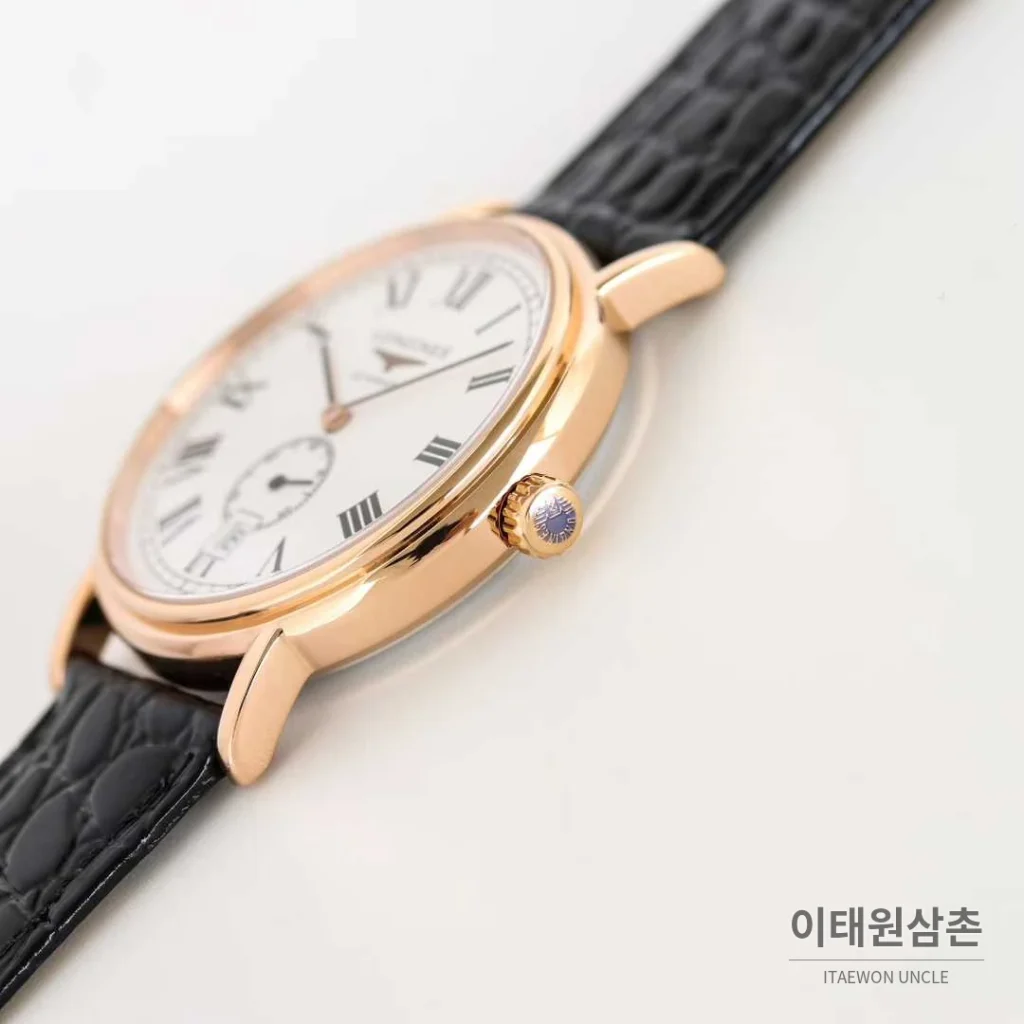 론진 엘레강스 스틸 화이트다이얼 로만인덱스 스몰세컨즈 오토매틱 38.5mm 블랙 가죽 스트랩 로즈골드 베젤