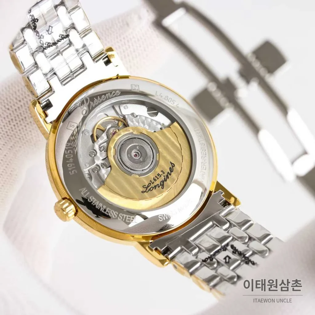 론진 엘레강스 스틸 화이트다이얼 로만인덱스 스몰세컨즈 오토매틱 38.5mm 투톤 브레이슬릿 골드 베젤