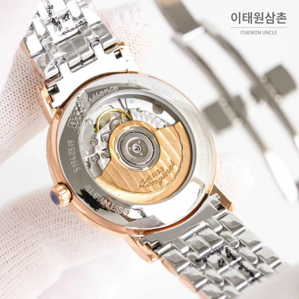 론진 엘레강스 스틸 화이트다이얼 로만인덱스 스몰세컨즈 오토매틱 38.5mm 투톤 브레이슬릿 로즈골드 베젤
