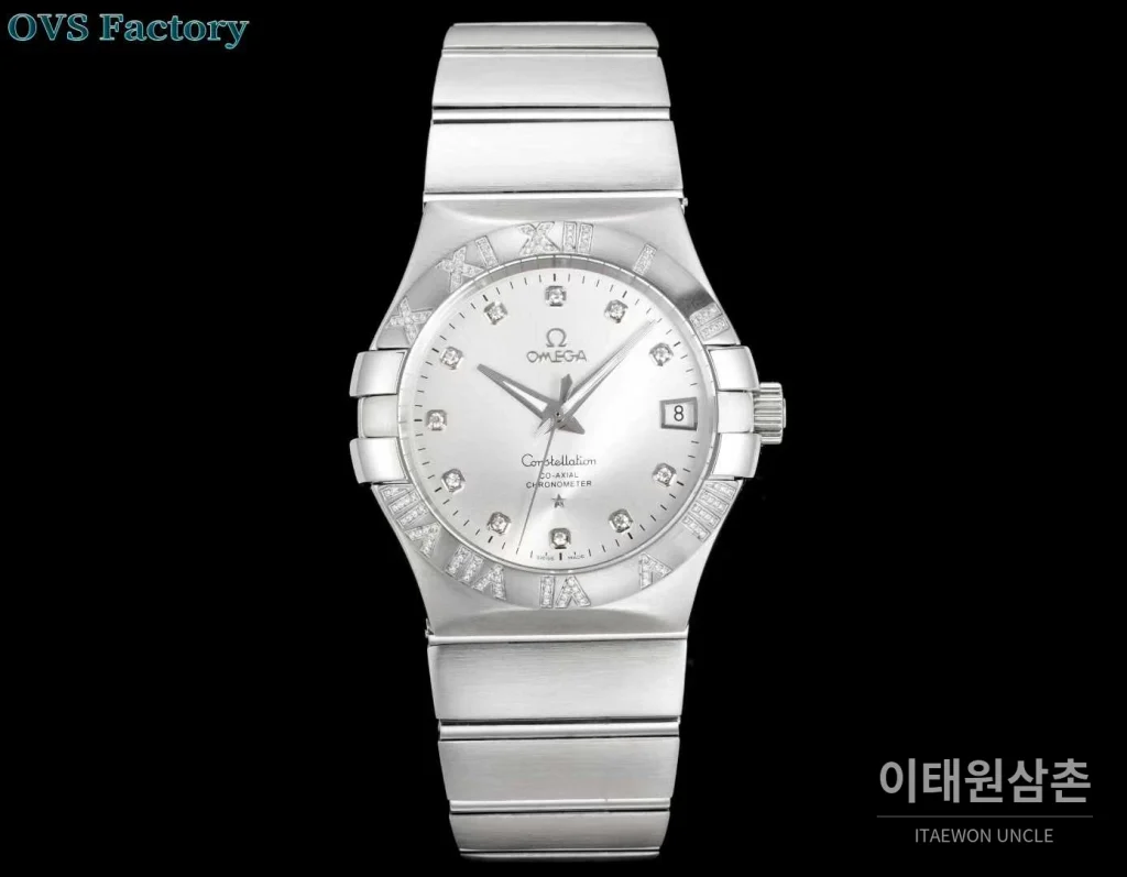 오메가 컨스텔레이션 스틸 골드톤 다이아몬드 로만베젤 데이트 오토매틱 38mm 골드 / 실버 스틸 브레이슬릿