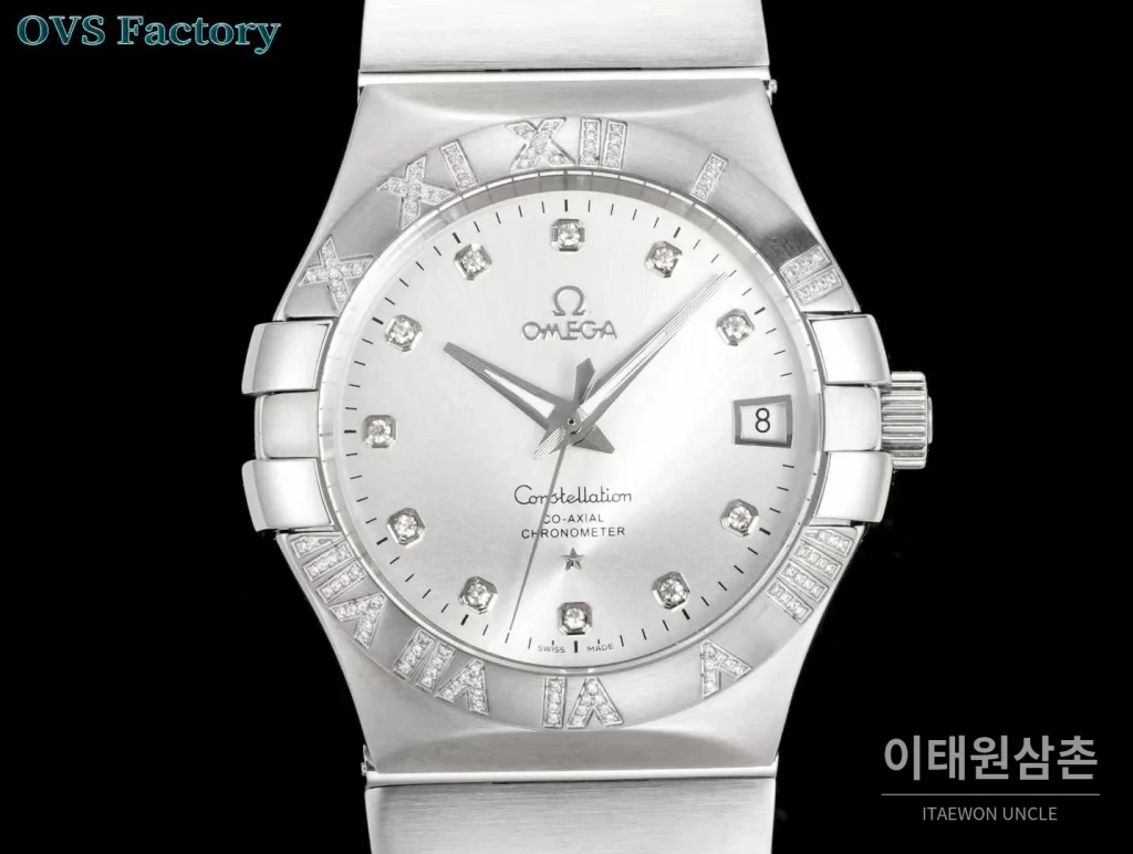 오메가 컨스텔레이션 스틸 골드톤 다이아몬드 로만베젤 데이트 오토매틱 38mm 골드 / 실버 스틸 브레이슬릿