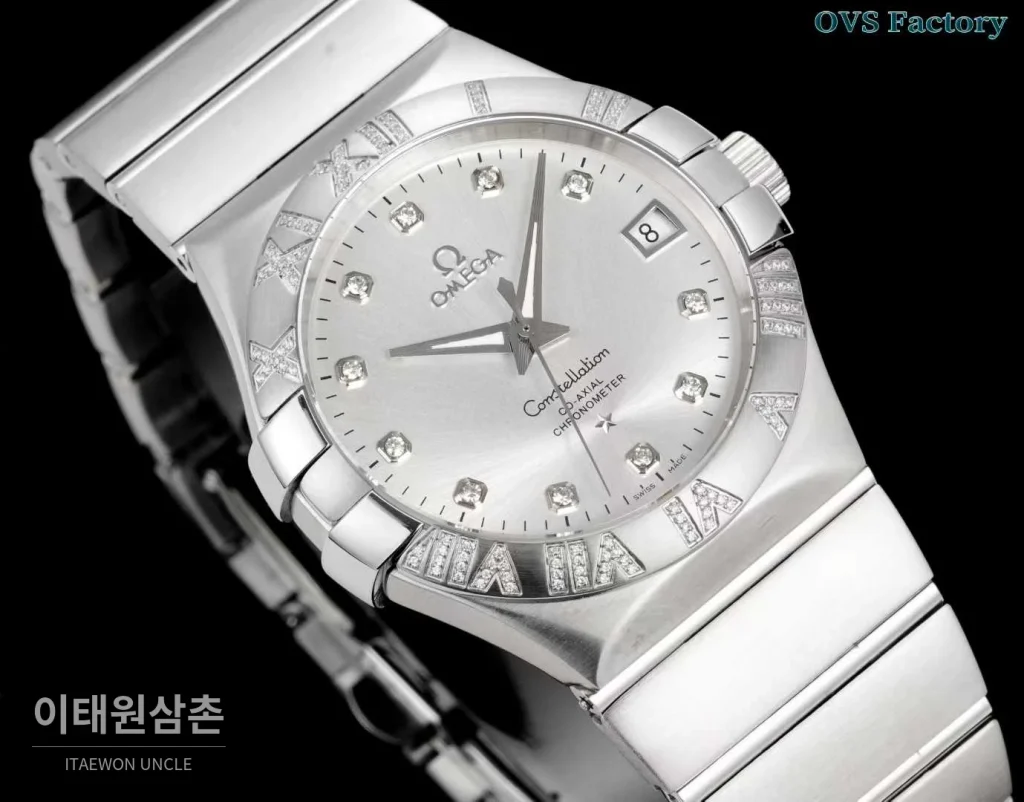 오메가 컨스텔레이션 스틸 골드톤 다이아몬드 로만베젤 데이트 오토매틱 38mm 골드 / 실버 스틸 브레이슬릿