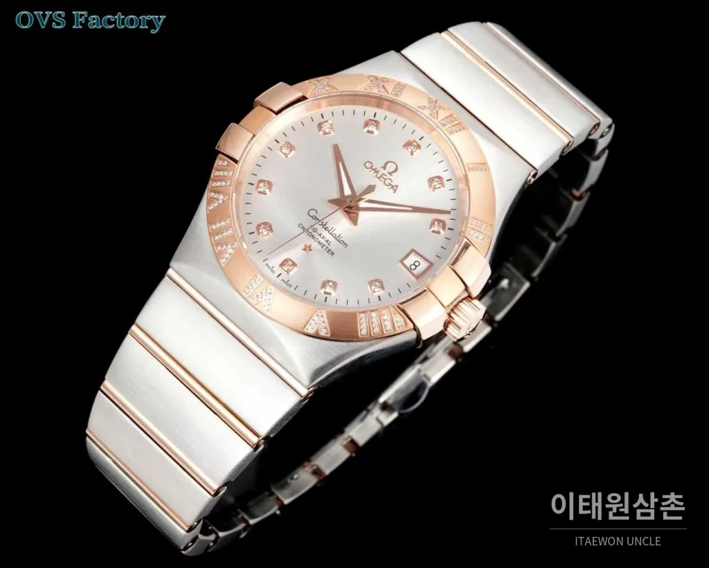 오메가 컨스텔레이션 스틸 골드톤 다이아몬드 로만베젤 데이트 오토매틱 38mm 골드 / 실버 투톤 브레이슬릿