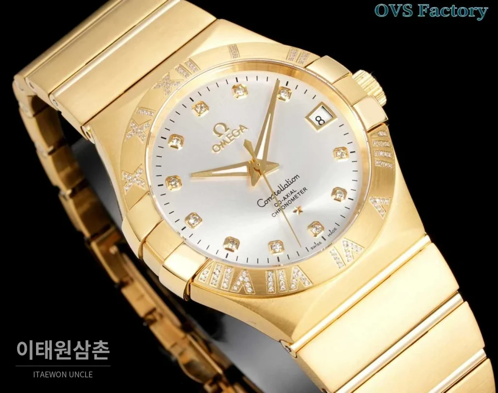 오메가 컨스텔레이션 스틸 골드톤 다이아몬드 로만베젤 데이트 오토매틱 38mm 골드 / 실버 골드 브레이슬릿