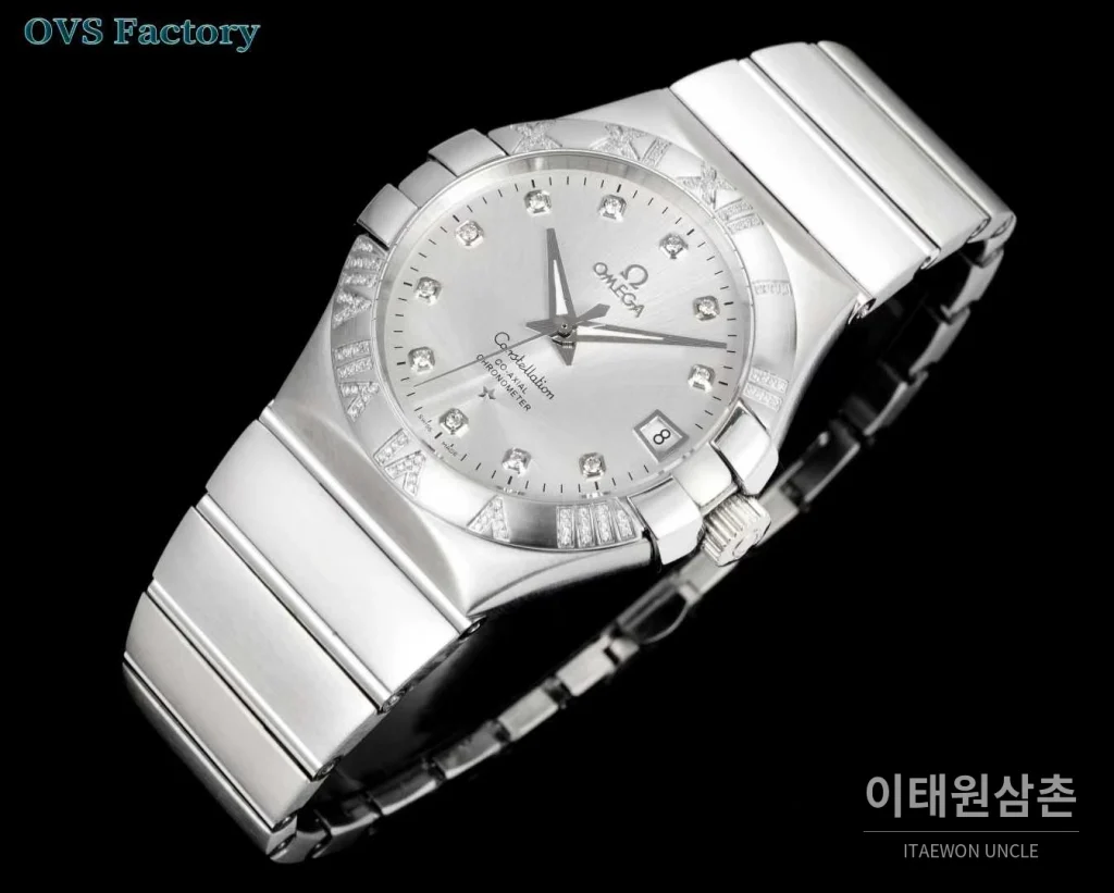 오메가 컨스텔레이션 스틸 골드톤 다이아몬드 로만베젤 데이트 오토매틱 38mm 골드 / 실버 스틸 브레이슬릿