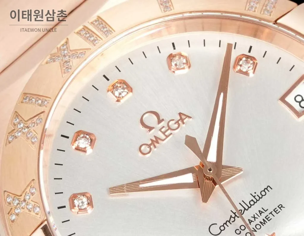 오메가 컨스텔레이션 스틸 골드톤 다이아몬드 로만베젤 데이트 오토매틱 38mm 골드 / 실버 로즈골드 브레이슬릿
