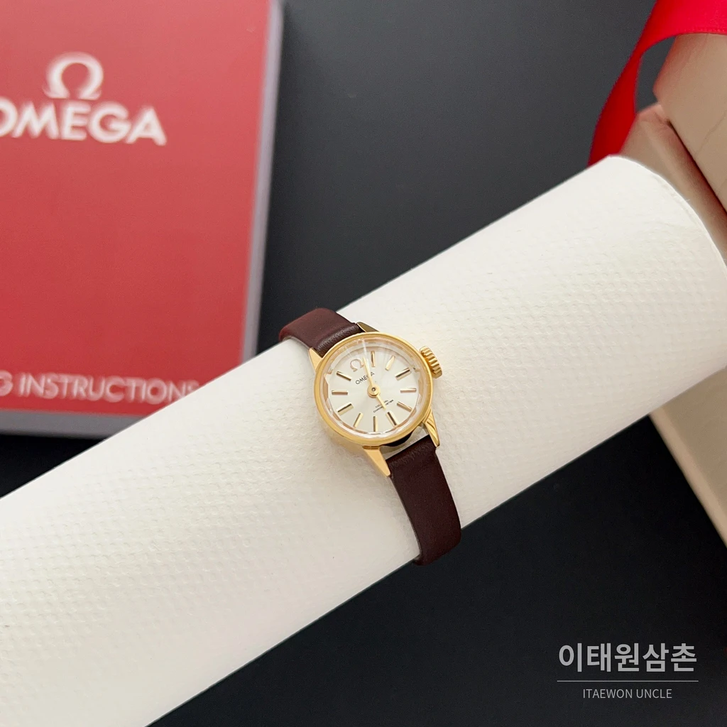 오메가 드빌 칼레이도스코프 다이아몬드컷 미니 여성시계 18.5mm 화이트 다이얼 브라운 가죽 스트랩 골드 베젤