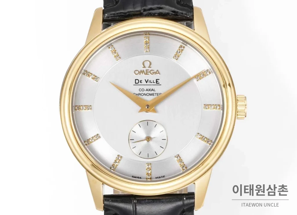 오메가 드빌 스틸 실버다이얼 오토매틱 가죽스트랩 드레스워치 39mm 골드 베젤