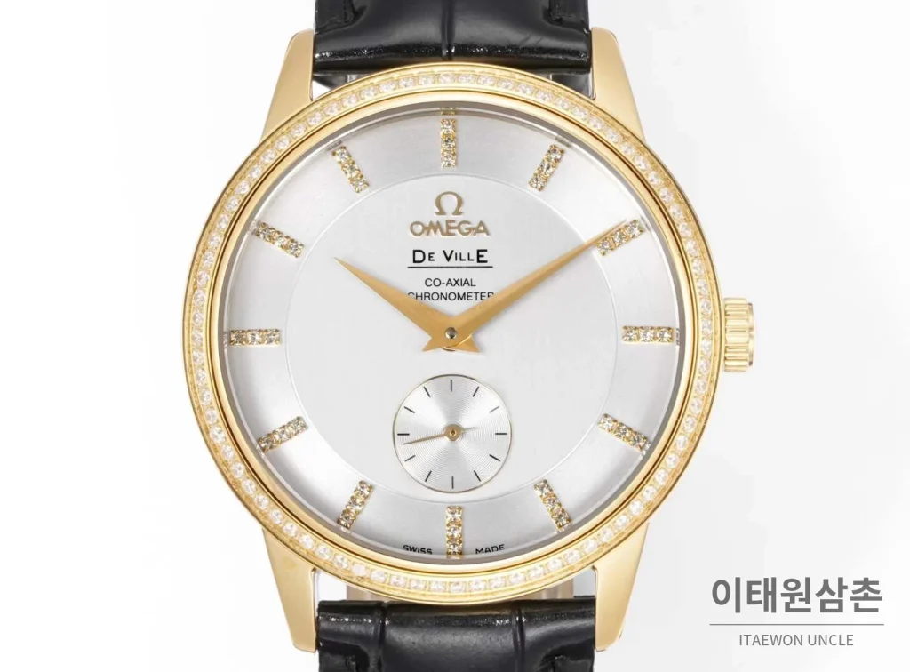오메가 드빌 스틸 실버다이얼 오토매틱 가죽스트랩 드레스워치 39mm 골드 베젤