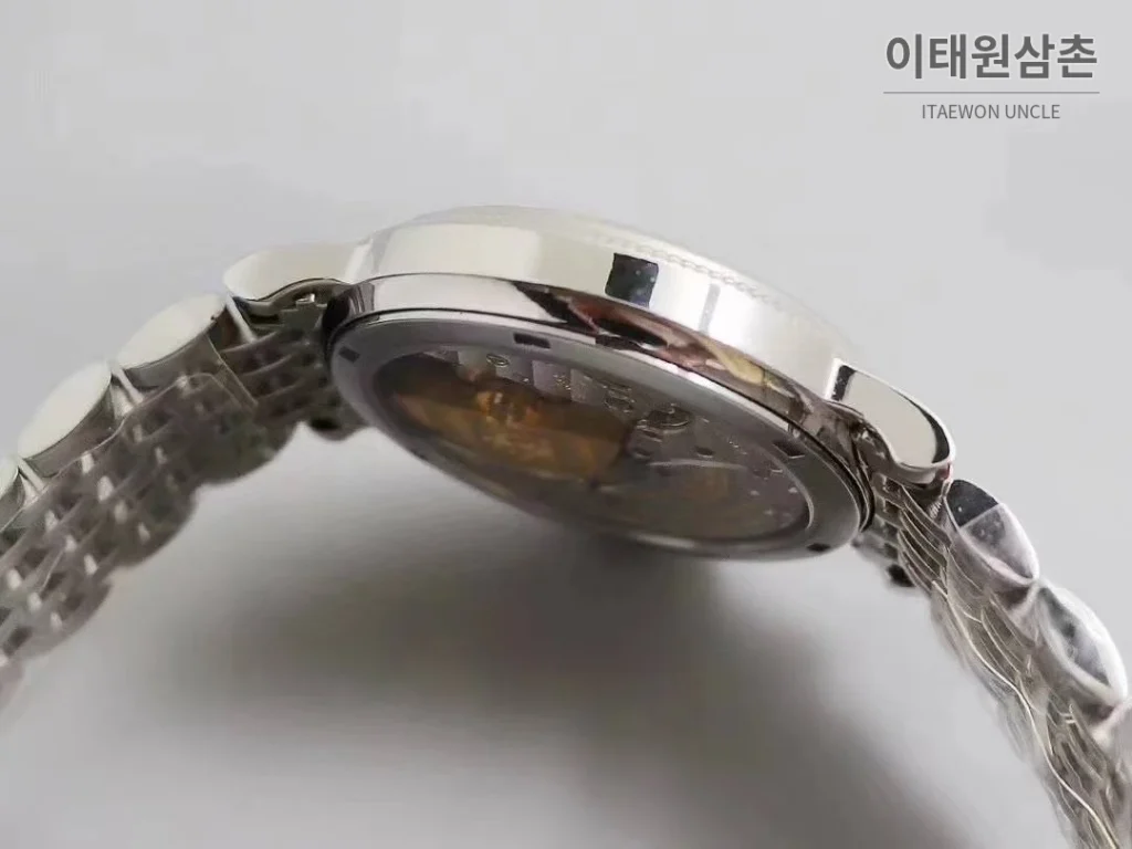 파텍필립 칼라트라바 화이트다이얼 로만인덱스 울트라씬 오토매틱 38mm 스틸 브레이슬릿
