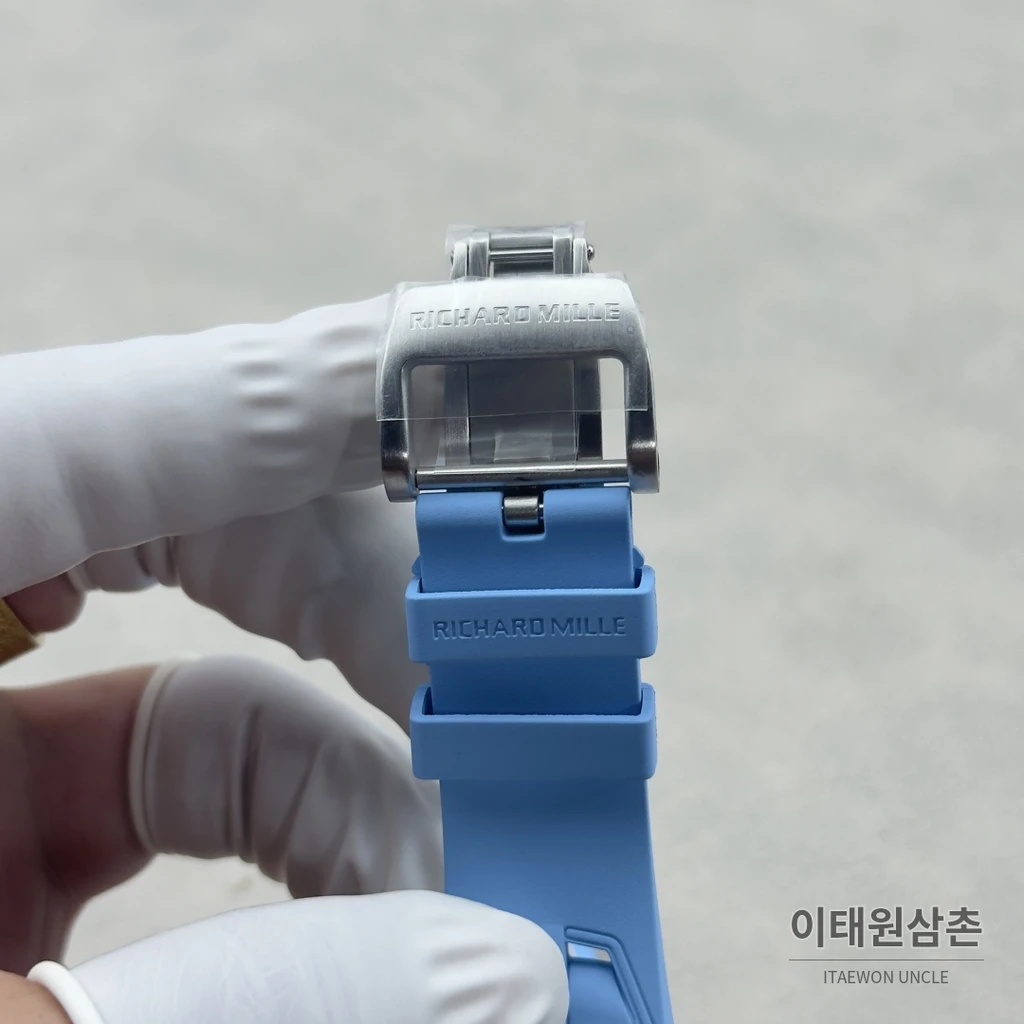 리차드밀 NTPT 카본 스켈레톤 오렌지 오토매틱 49.95mm 스켈레톤 다이얼 아이스블루 러버 스트랩