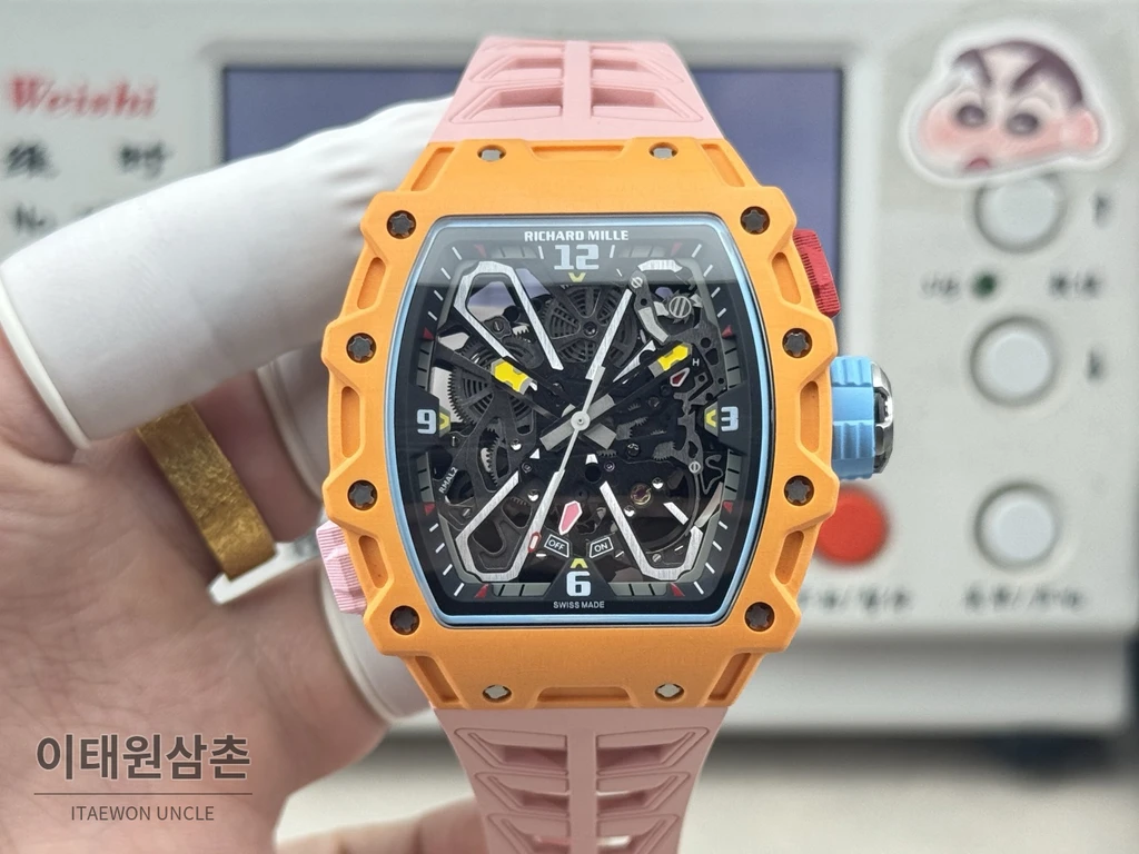 리차드밀 NTPT 카본 스켈레톤 오렌지 오토매틱 49.95mm 스켈레톤 다이얼 핑크 러버 스트랩