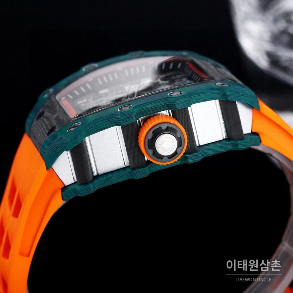 리차드밀 RM21-01 카본파이버 스켈레톤 오토매틱 50mm 블랙 오렌지 러버 스트랩 그린 베젤