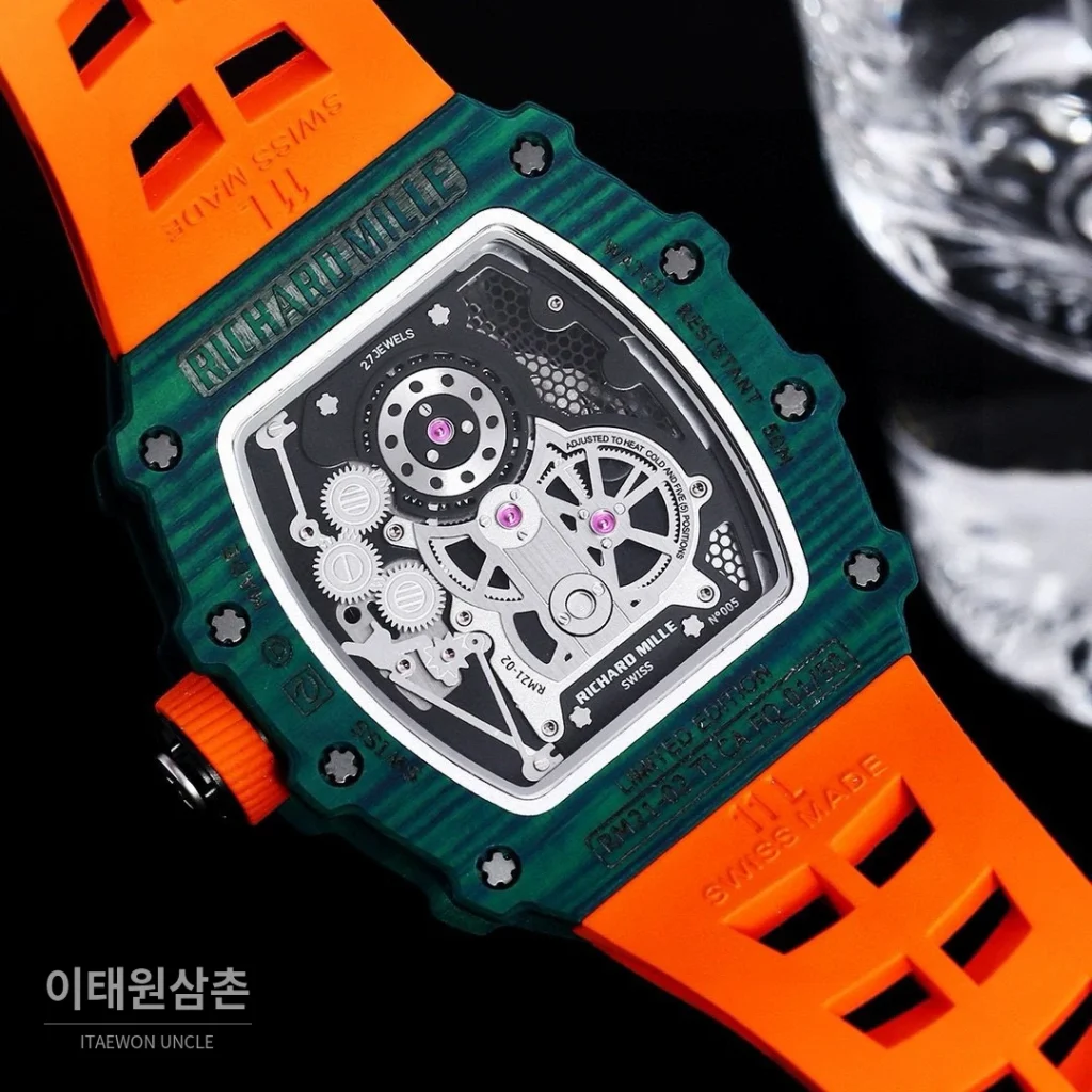 리차드밀 RM21-01 카본파이버 스켈레톤 오토매틱 50mm 블랙 오렌지 러버 스트랩 그린 베젤