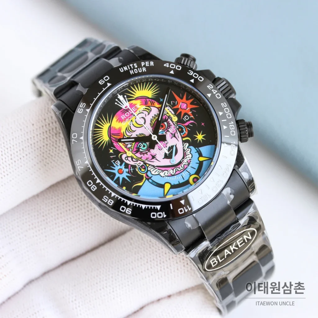 롤렉스 데이토나 크로노그래프 오토매틱 40mm 멀티컬러 다이얼 블랙 러버 스트랩 블랙 베젤