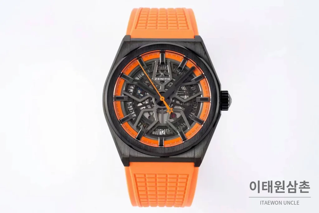 제니스 디파이 스켈레톤 스틸 스타다이얼 오토매틱 41mm 오렌지 러버 스트랩 블랙 베젤