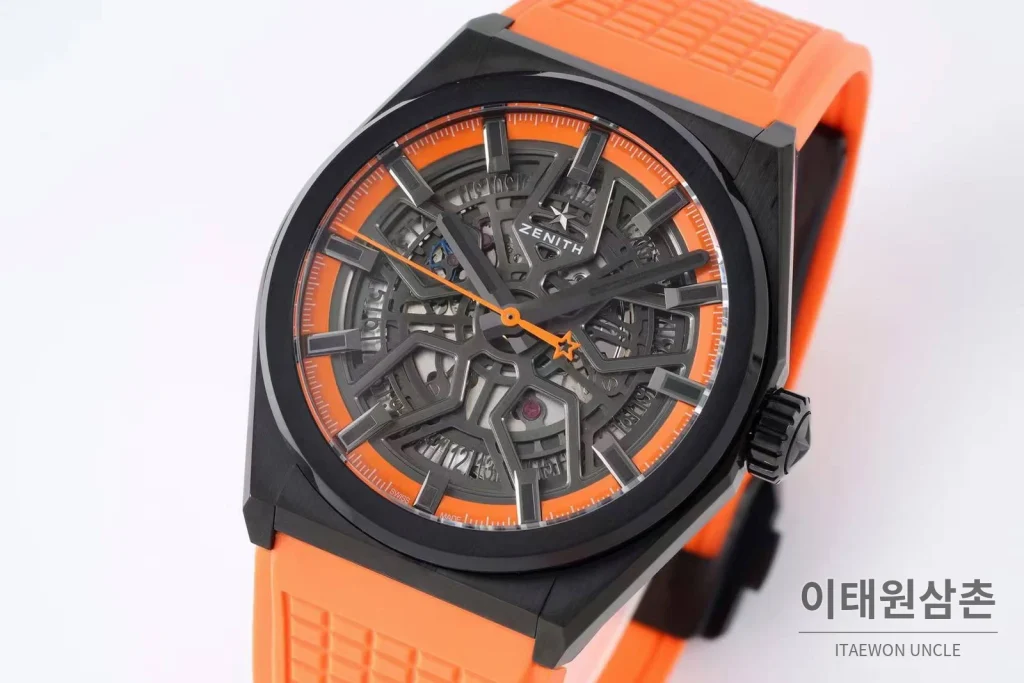 제니스 디파이 스켈레톤 스틸 스타다이얼 오토매틱 41mm 오렌지 러버 스트랩 블랙 베젤