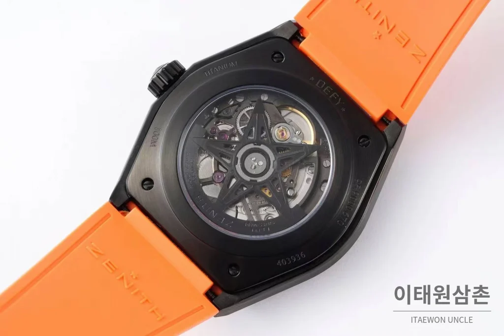 제니스 디파이 스켈레톤 스틸 스타다이얼 오토매틱 41mm 오렌지 러버 스트랩 블랙 베젤
