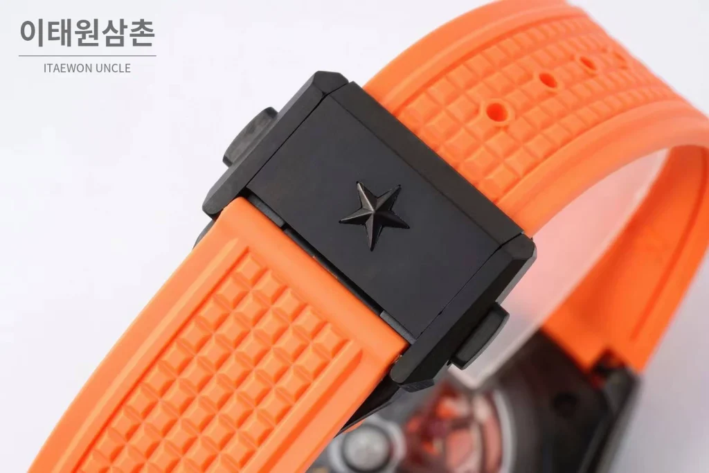 제니스 디파이 스켈레톤 스틸 스타다이얼 오토매틱 41mm 오렌지 러버 스트랩 블랙 베젤